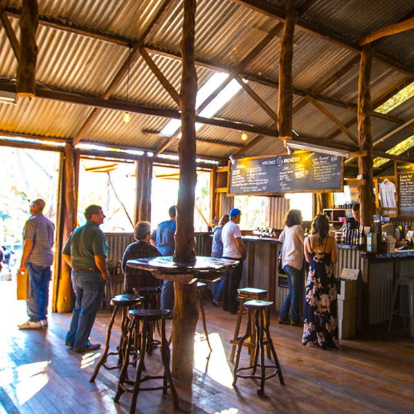 A rustic bar scene at sunset of woolshed brewery