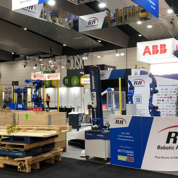 Tin Can helping to set up the RA booth at AUSPACK 2022